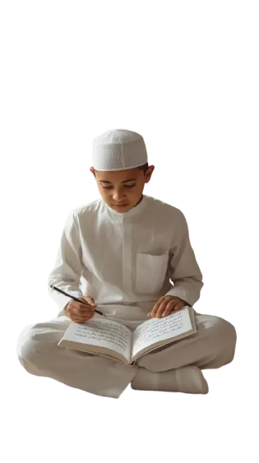 Young boy reading the Quran while sitting and studying Arabic
